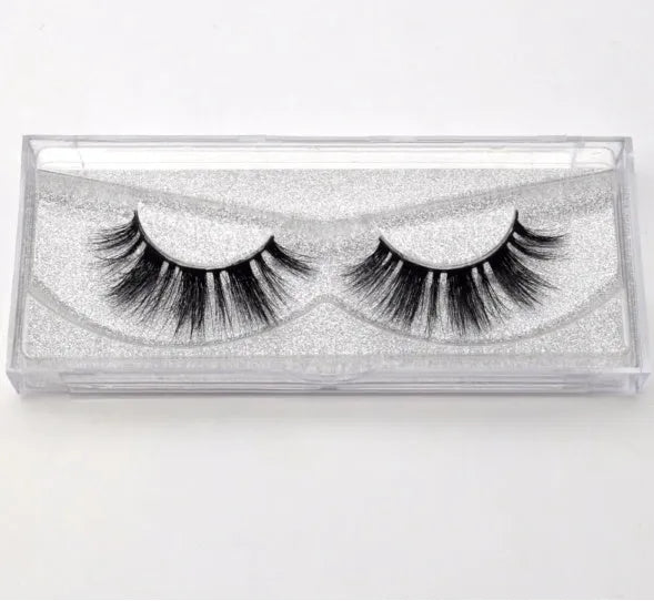 Pair of faux mink eyelashes with long tail and cotton stem against white background