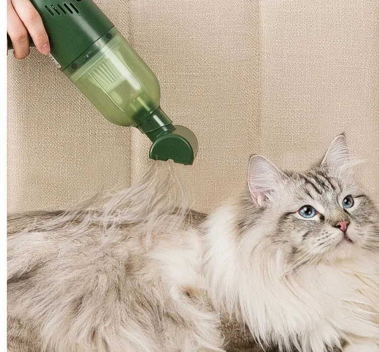 Green electric cat hair cleaner with suction heads for beds