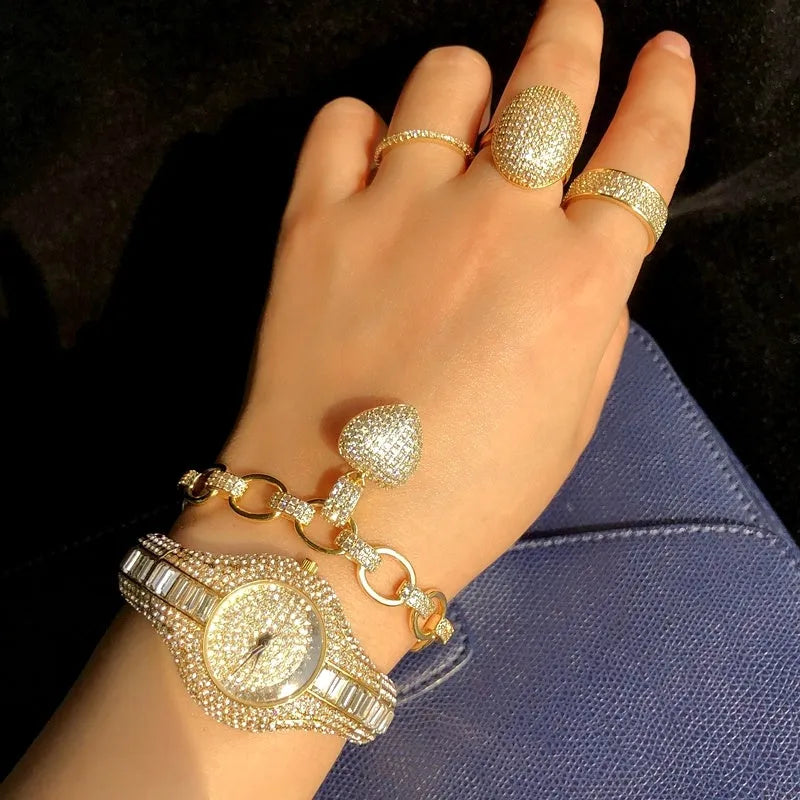 Women's gold alloy quartz watch with round dial showing diamond and colourful stone inlays