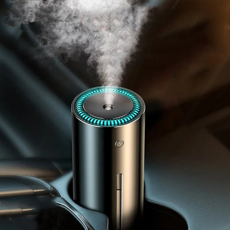 Black aluminium car humidifier and air purifier unit with USB cable on a car dashboard.