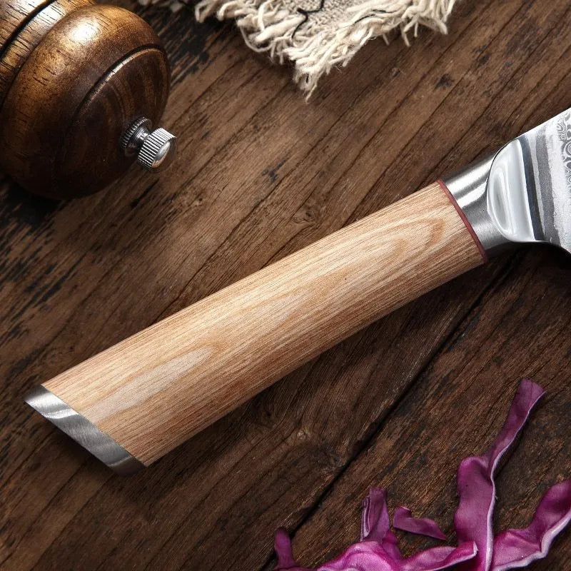12-piece Damascus steel kitchen knife set with various blade types on a wooden block.