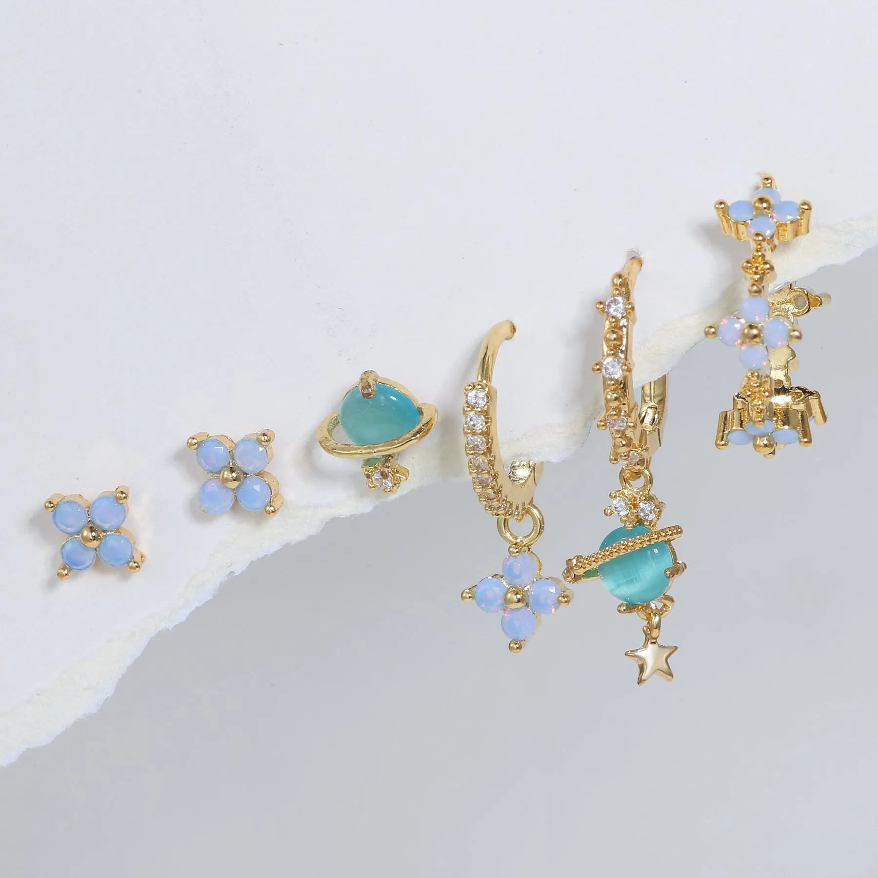 Blue protein colour flower nail design earrings with zircon accents in gold and silver options