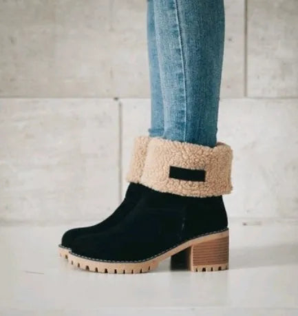 Women's mid-calf suede snow boots in black with a thick low heel and waterproof platform.
