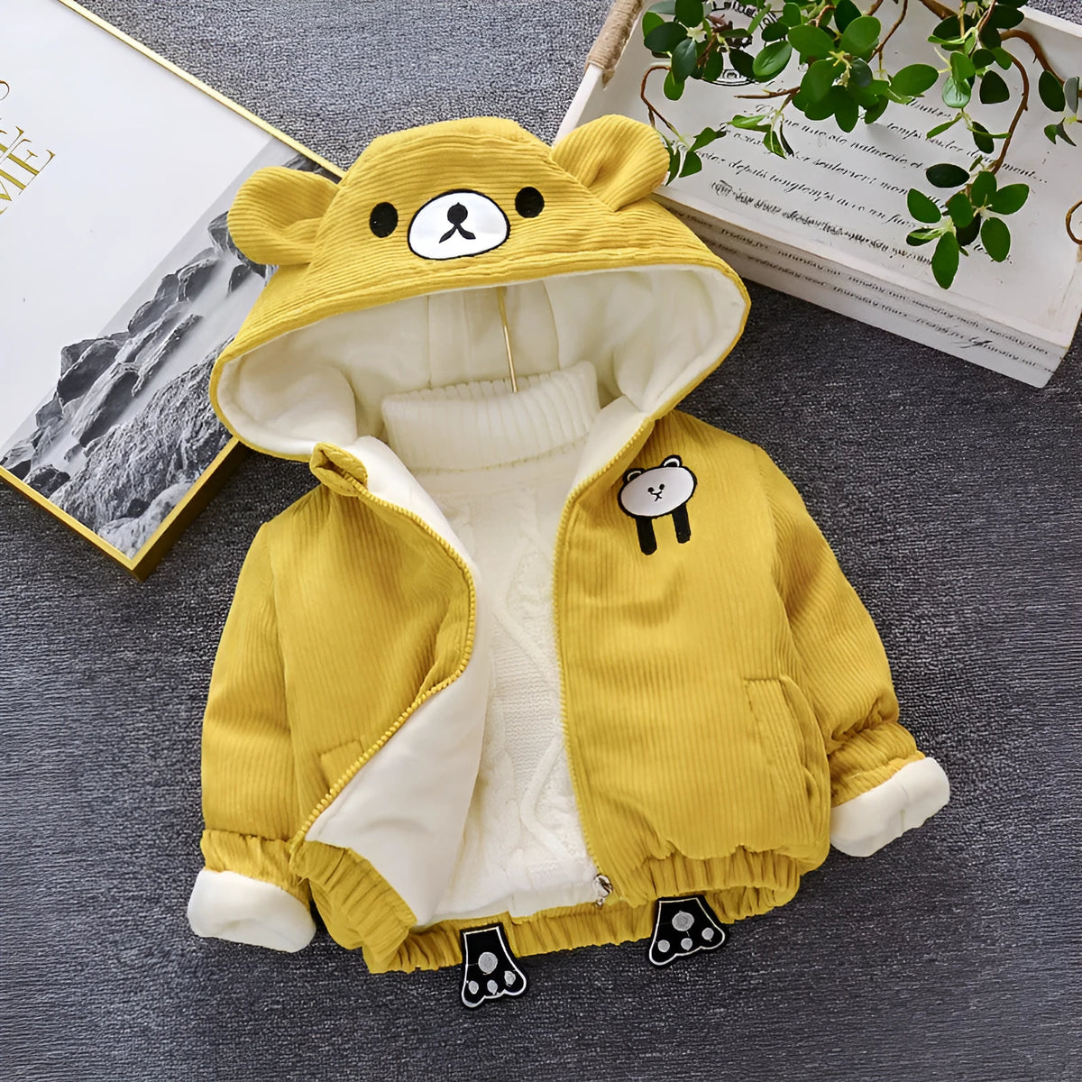 Striped corduroy baby girl coat with hood on hanger, khaki colour, side view showing ribbed texture and button closure