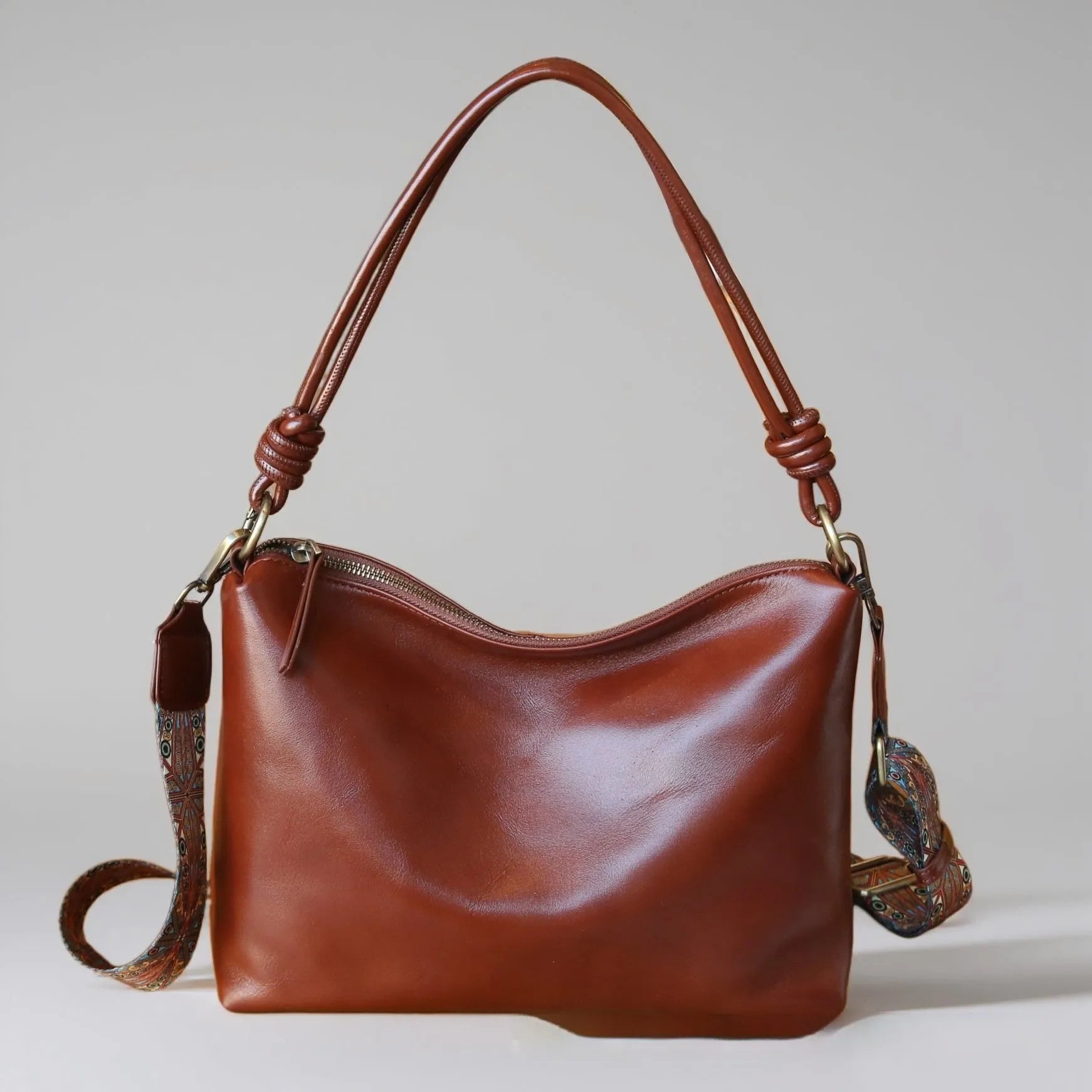 Genuine leather hand shoulder bag in caramel colour, pillow shape, top grain leather, 31x11x24cm