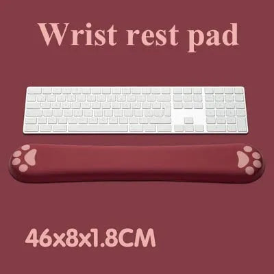 Cat's Claw cartoon design memory foam keyboard wrist rest pad in blue, shown on a desk.