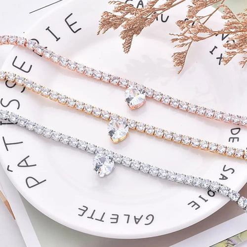 Heart-shaped rhinestone pet collar in metallic gold with extension chain for dogs and cats
