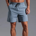 A pair of men's loose-fit casual shorts in a straight cut style, shown in one of the available colours.