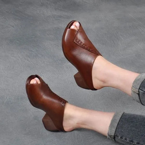 Women's black square heel peep-toe slippers showing fish mouth scaffold design and rubber sole