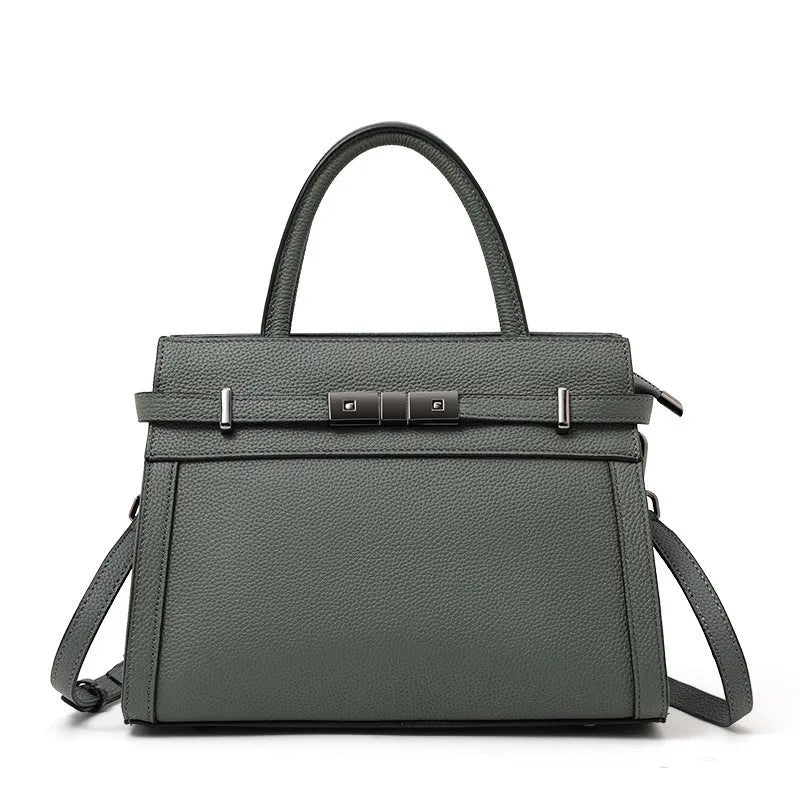 Women's genuine leather crossbody bag in horizontal square shape with clamshell opening showing internal organisation pockets