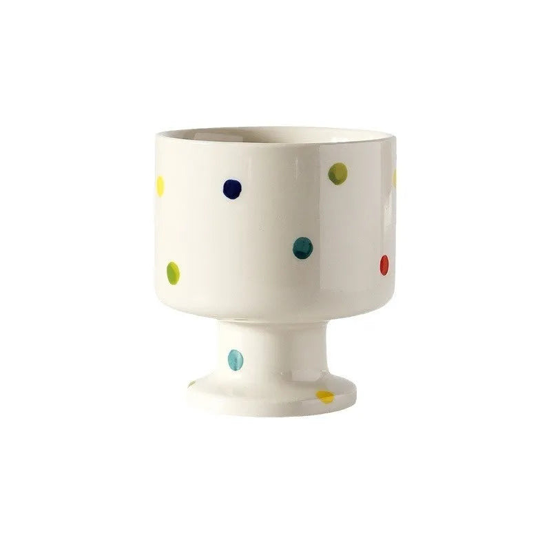 Hand-pinched irregular ceramic mug showing solid colour and unique shape