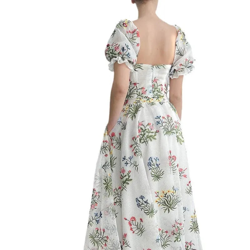 Women's fitted waist backless embroidered floral white two-piece set with mid-length skirt on white background