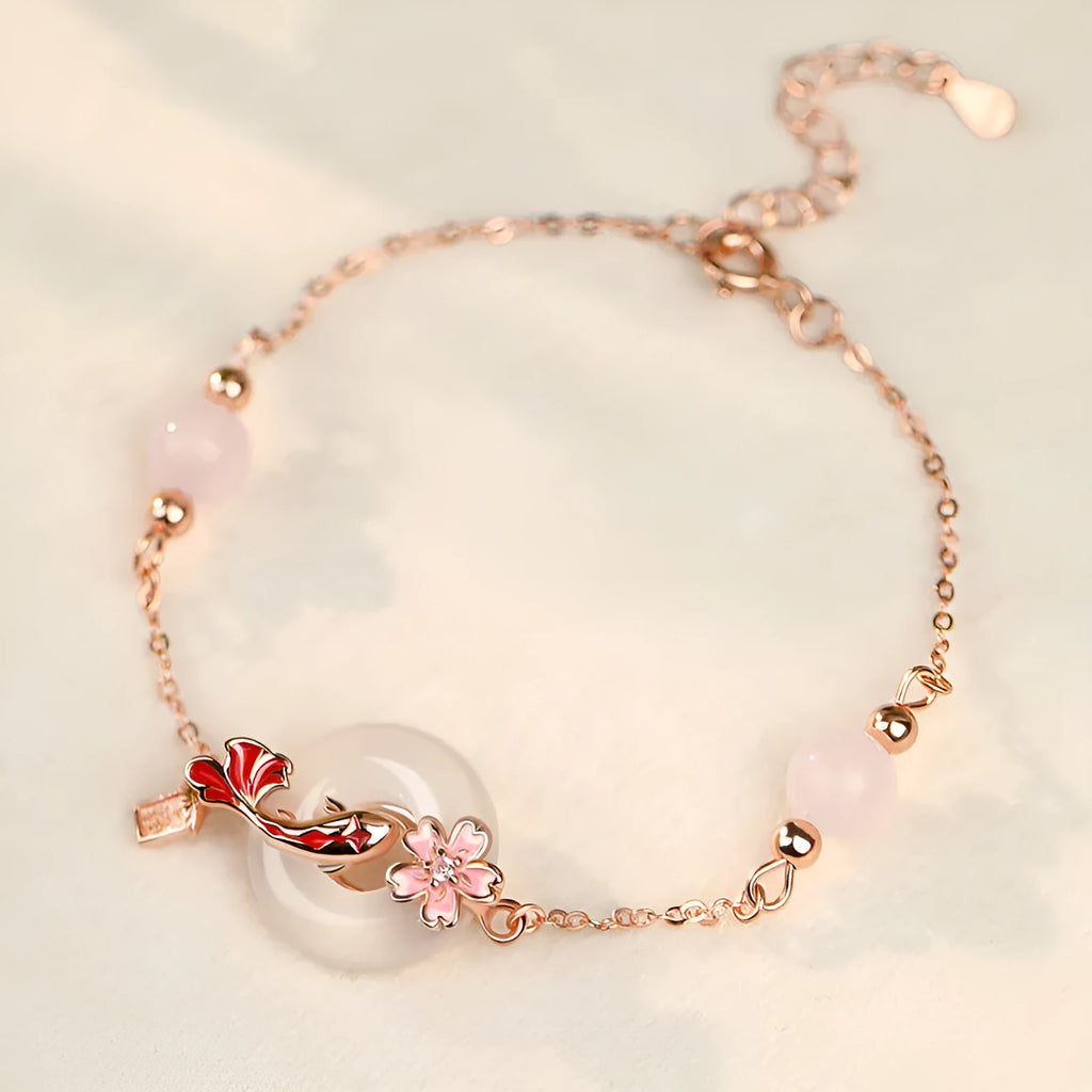 S925 sterling silver bracelet with white chalcedony crystals and a floral koi design.