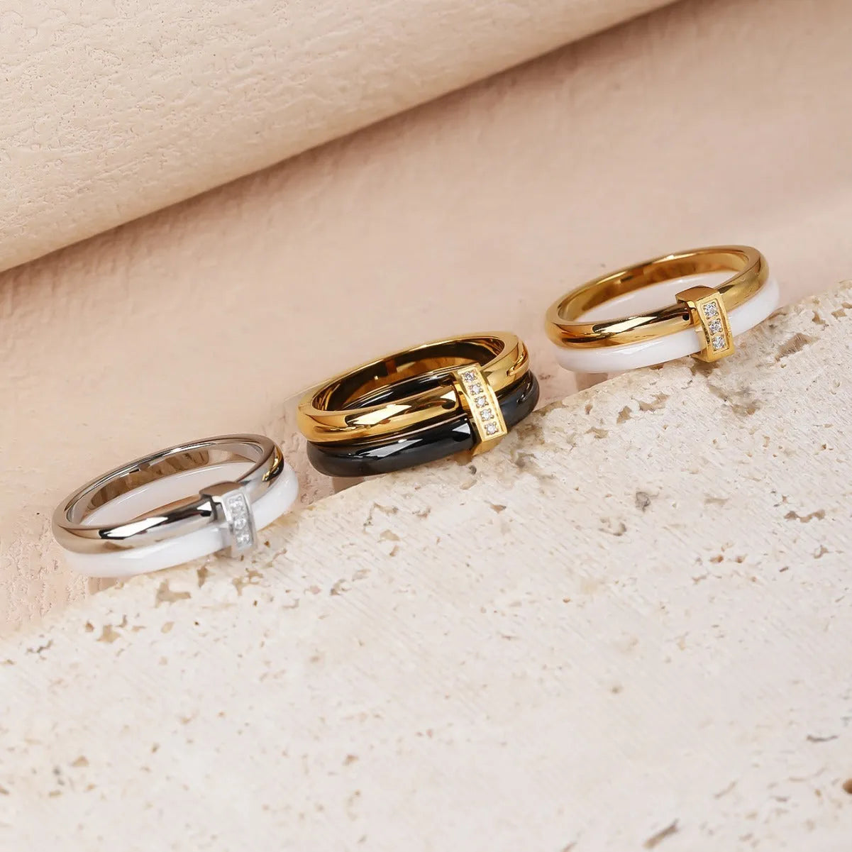 Women's titanium steel heart-shaped double ring with glossy stitching and zirconium accents in gold black.