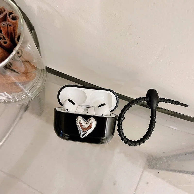 Black earphone sleeve with electroplated love heart design for AirPods case showing TPU back cover and black cord