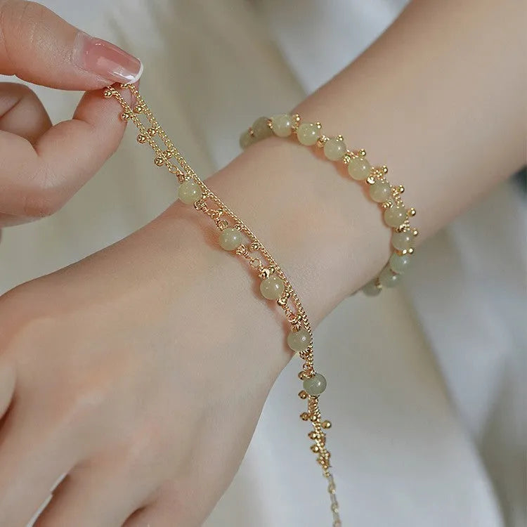 Hetian Jade bracelet with princess running beaded style on neutral background