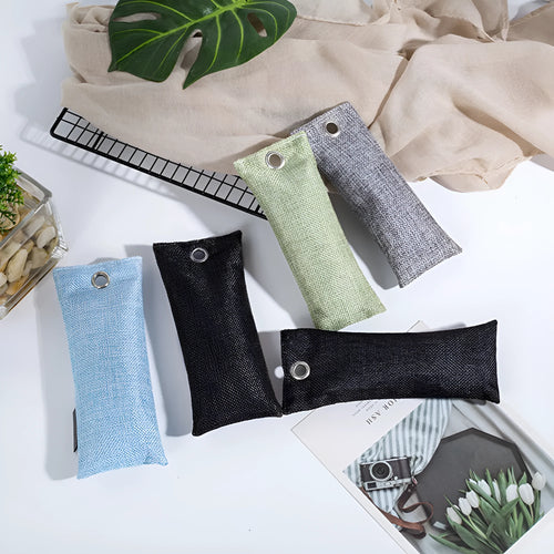 Black bamboo charcoal deodorising bag for shoes measuring 16.5 by 6.5 centimetres