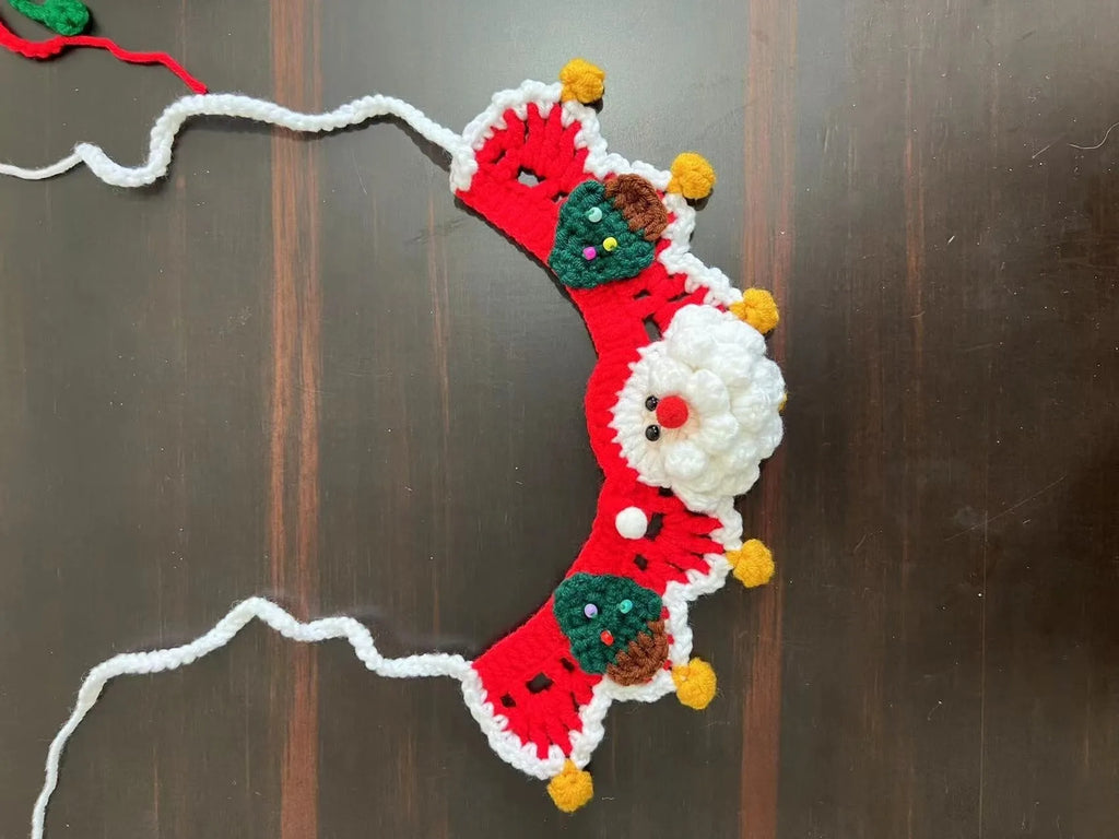Knitted wool Christmas scarf for pets featuring festive patterns like striped Santa and elk, shown attached to a dog collar.