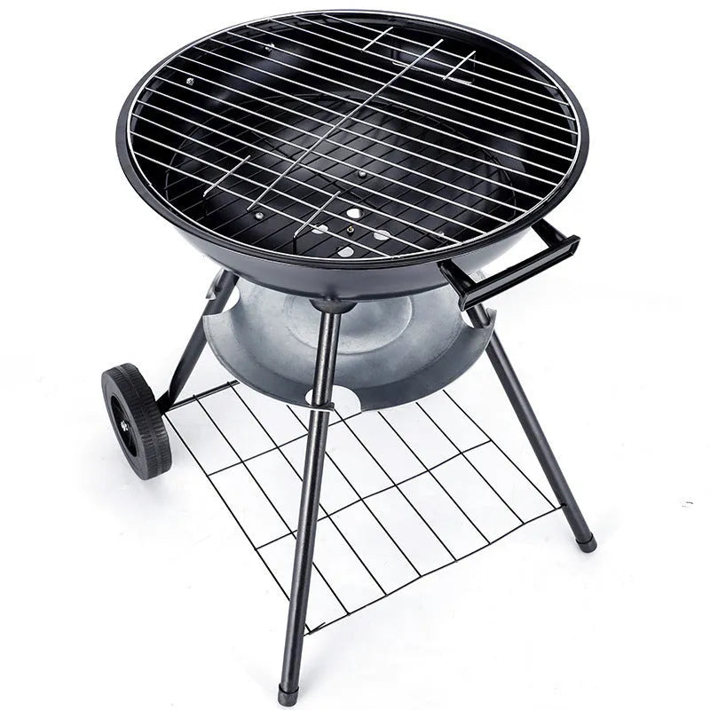 A portable cast iron barbecue oven with a 14-inch cooking surface, shown outdoors.