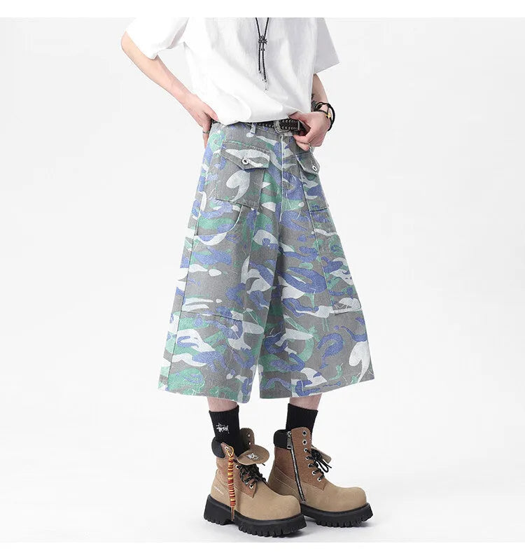 Cropped camouflage denim work trousers with straight leg cut and zipper fly closure