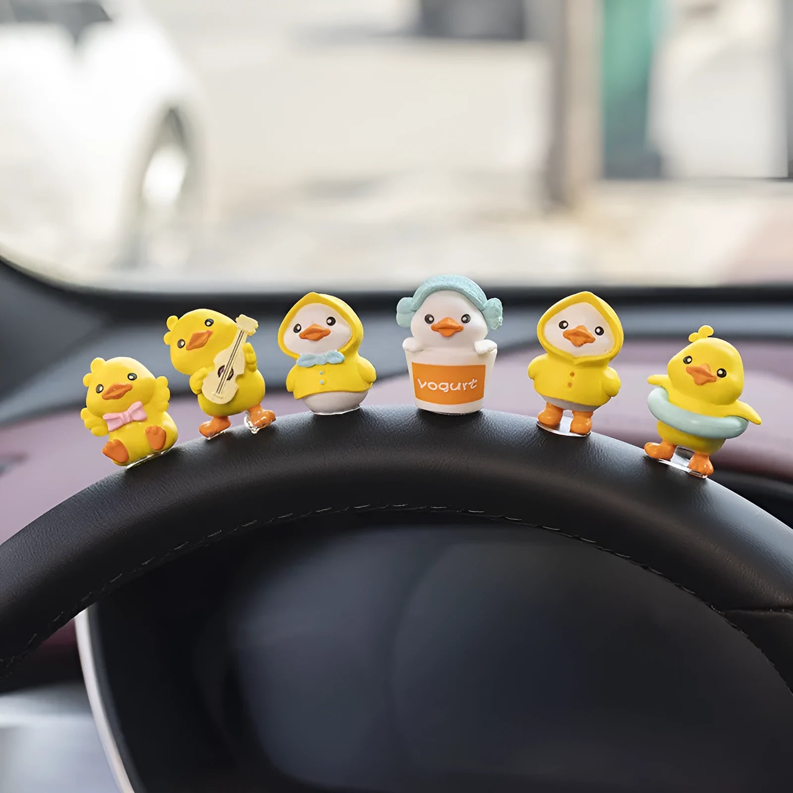 PVC cartoon duckling car decoration set with six small ducks and one hello welcome sign.