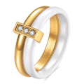 Glossy black ceramic women's ring with silver stitch-inlaid zirconium detail on a geometric band.