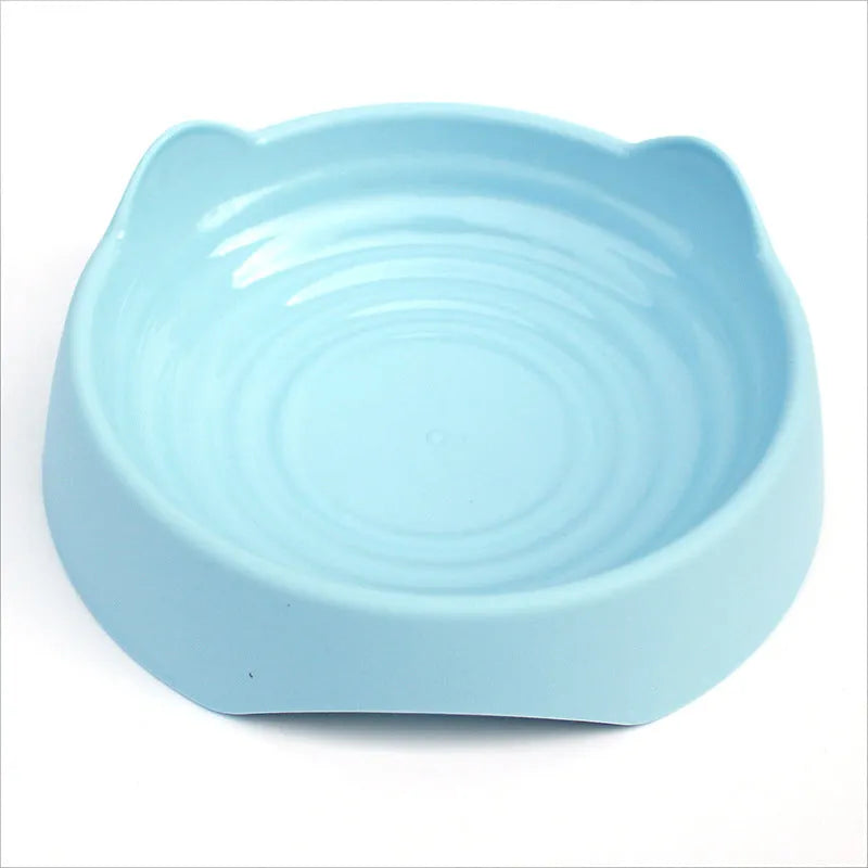 Ceramic dog slow feeder bowl with puzzle maze design in blue, green and pink colours showing S and L size options