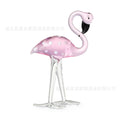 Pink and white crystal flamingo decorative ornament on a table, showing modern simple style.