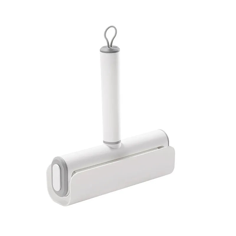 Lint remover roller pet tool with four replaceable adhesive cores for cat hair and dust removal.