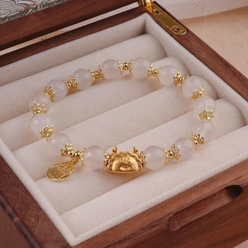 Women's floral glazed zodiac animal bracelet with glass beads in red, pink and white colours