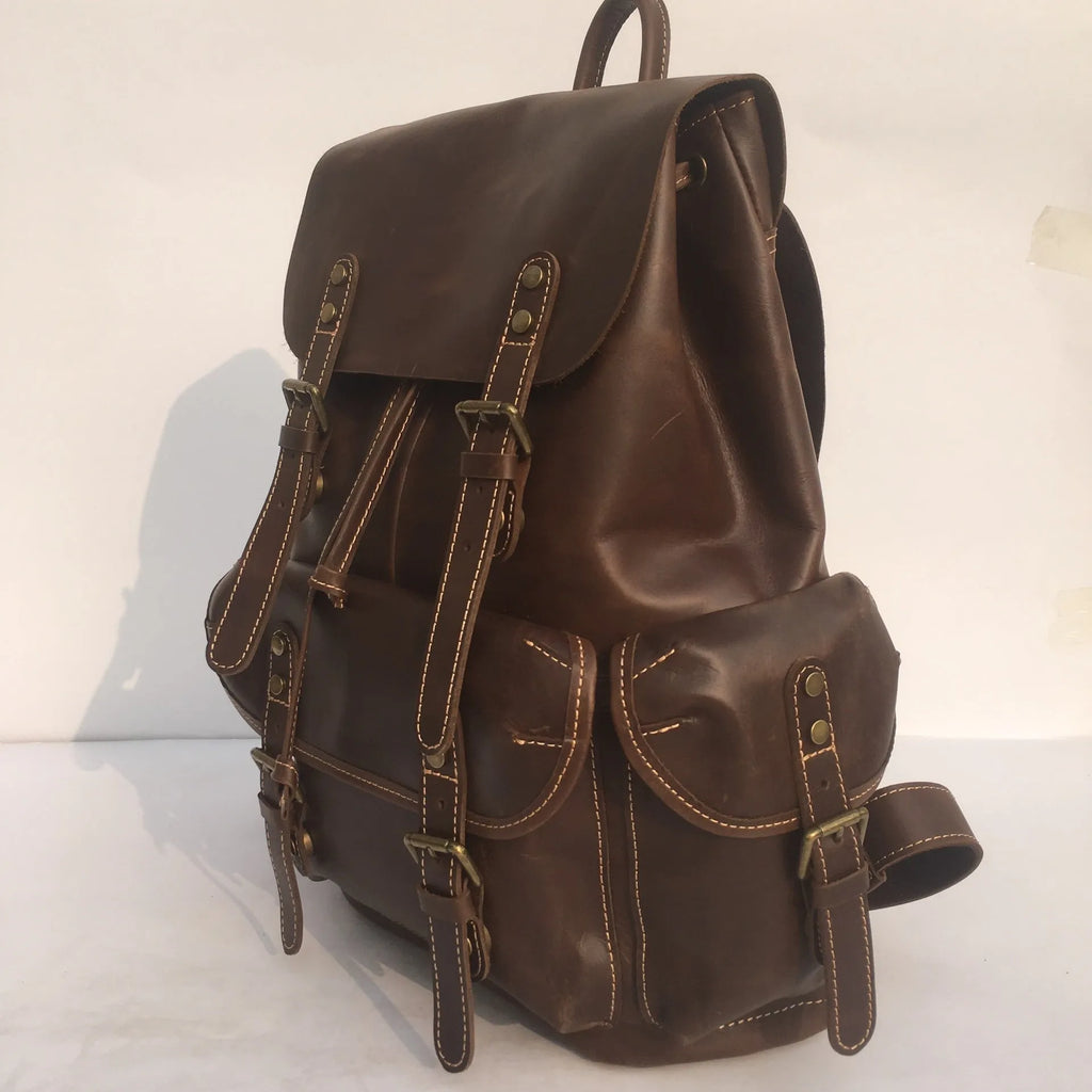 Brown genuine leather men's backpack with an air pillow belt system on the straps.