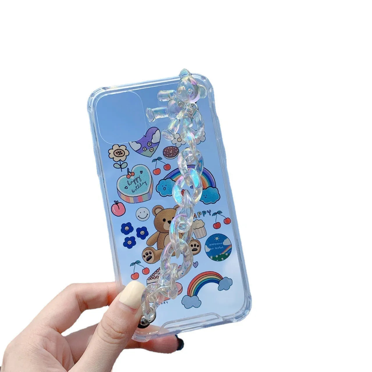 White iPhone case with a bear cartoon design and a silver chain with a bear pendant attached.