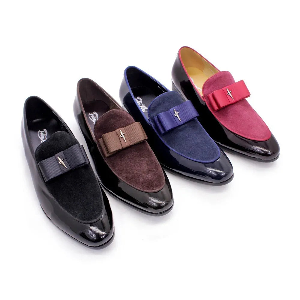 Men's glossy black patent leather low-top shoes with a tassel detail on a white background.