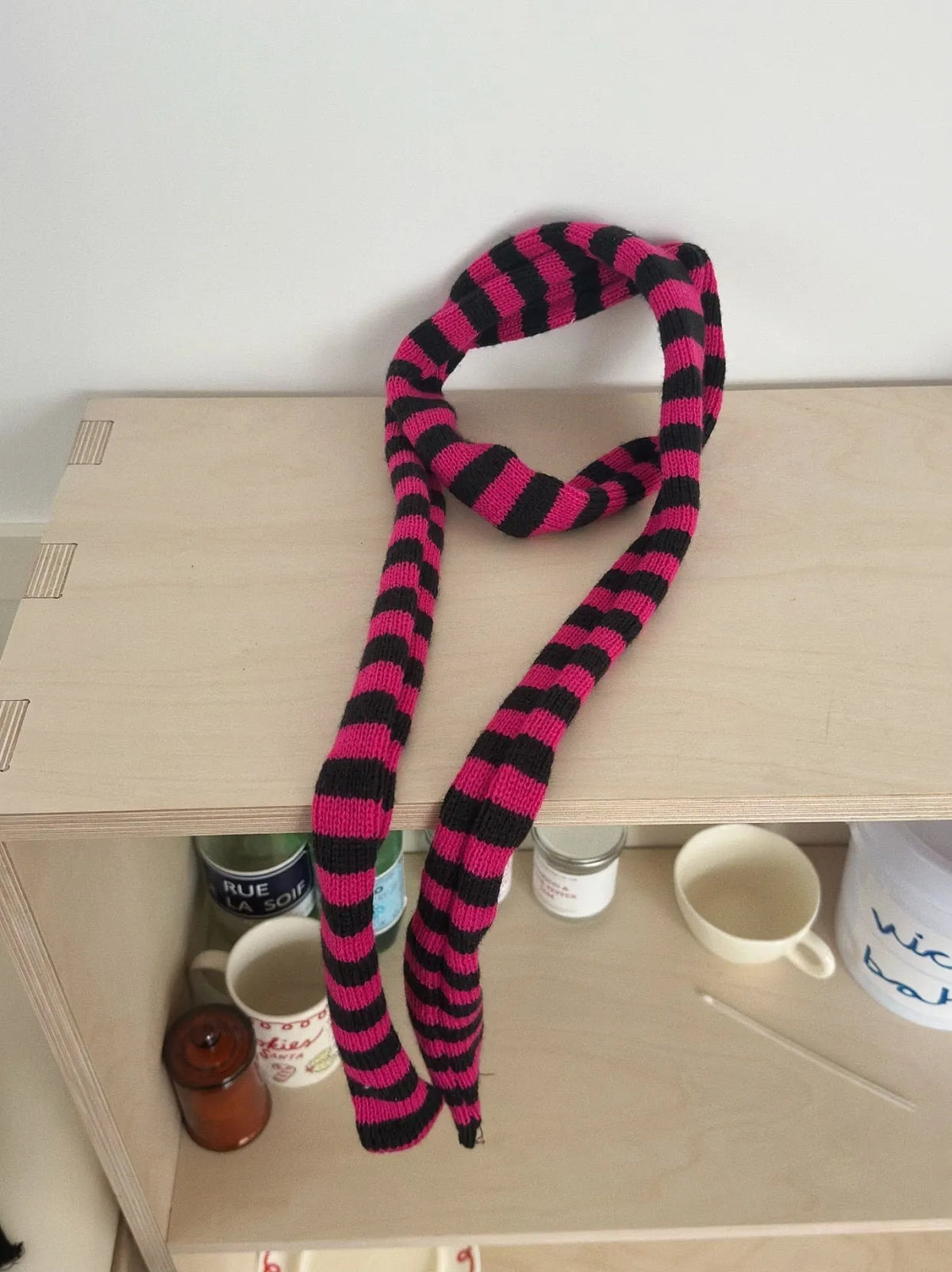 Black and white striped thickened wool decorative thin scarf on neutral background, unisex yarn knit style
