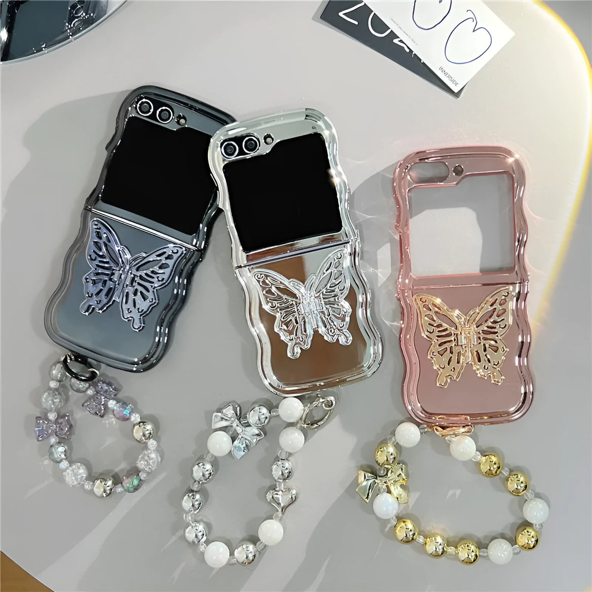 Samsung Z Flip phone case with electroplated wave edge and three-dimensional butterfly bracket stand in rose gold