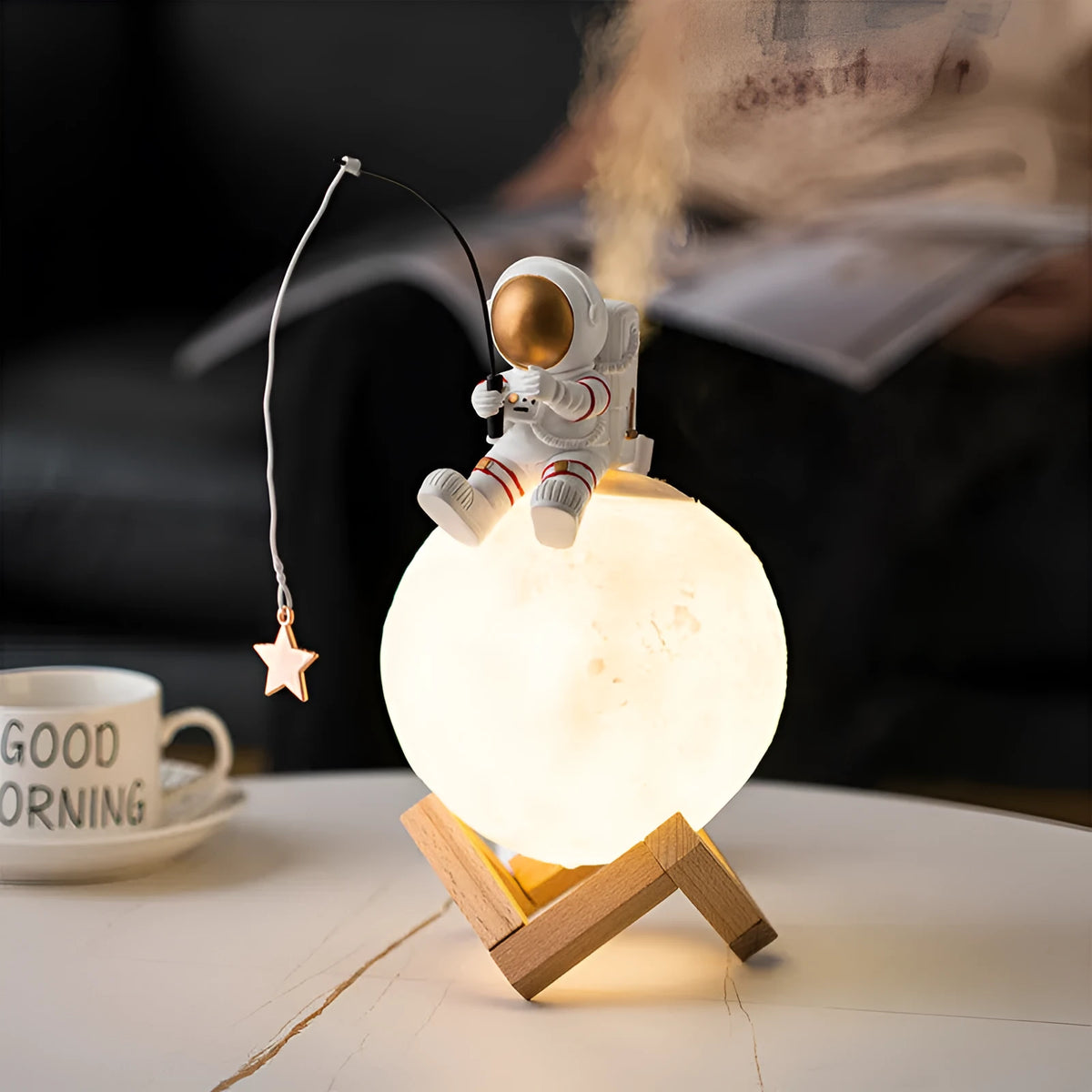 Gold astronaut resin figurine USB humidifier and night light on a wooden base
