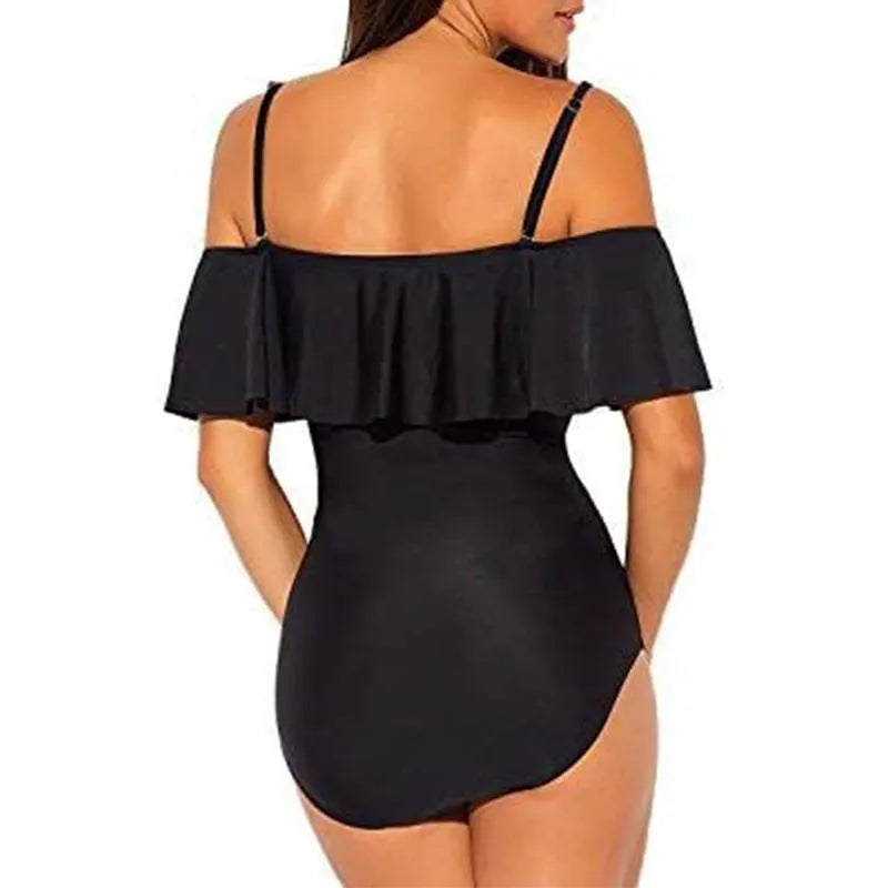 Black one-piece swimsuit with cut-out design and ruffled straps on a mannequin.