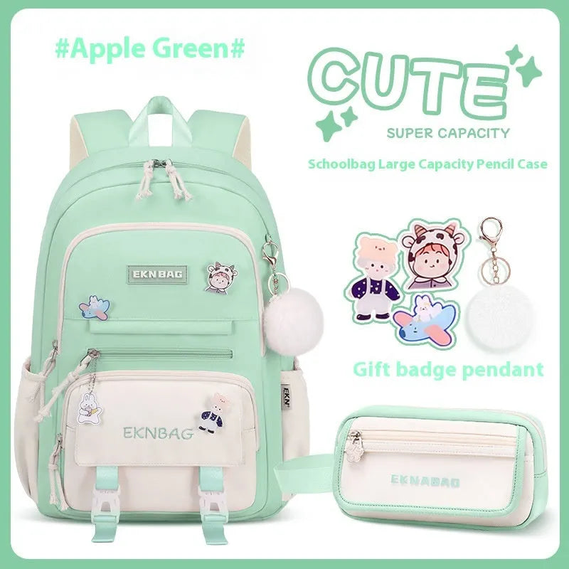 Girls' pink waterproof Oxford cloth school backpack with curved shoulder straps.