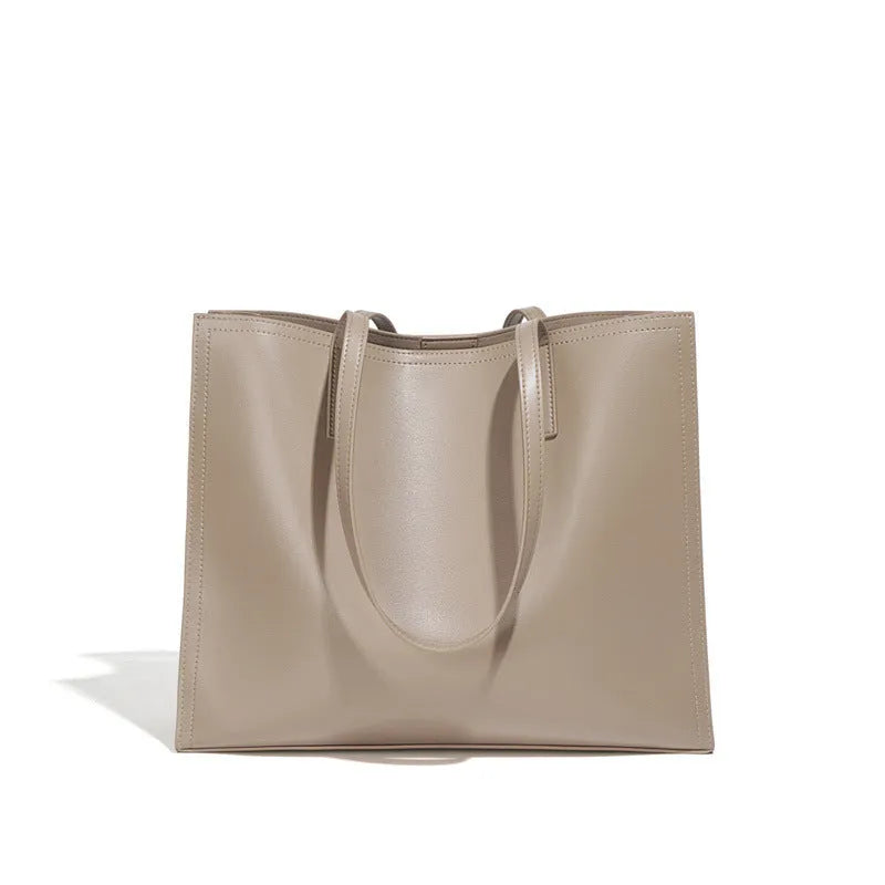 Brown genuine leather one shoulder handbag with horizontal square shape showing multiple internal compartments