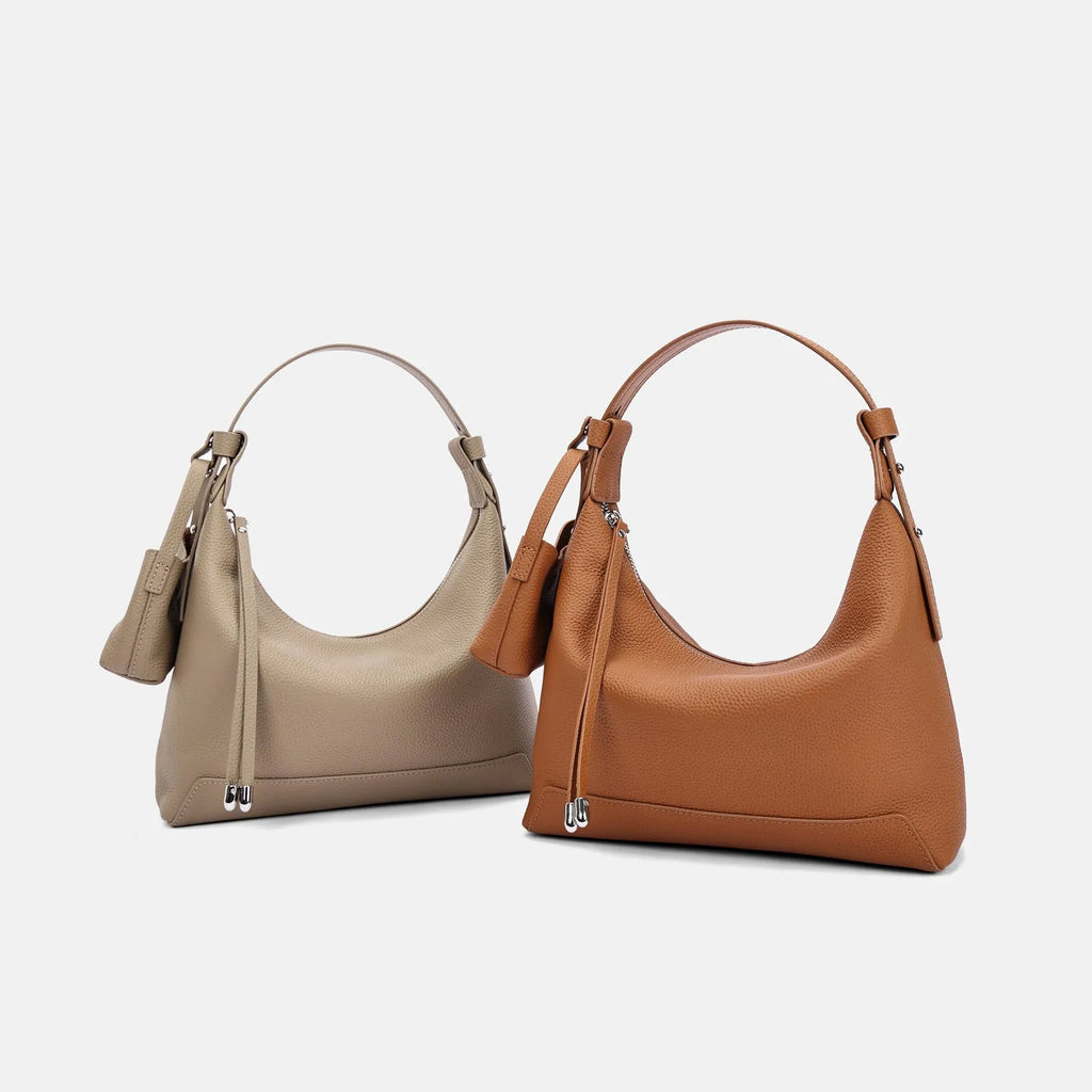 Genuine cowhide leather shoulder bag in urban simplicity style with visible sewing thread details