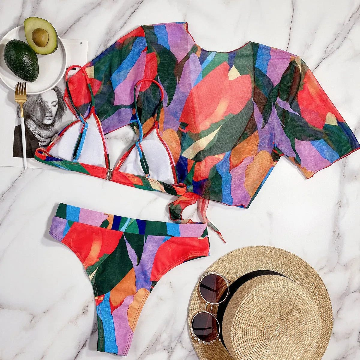 Red women's split bikini swimsuit made from nylon fabric.