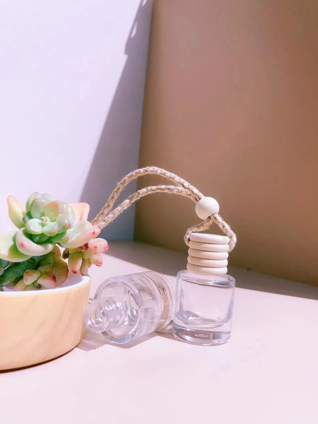 Glass car perfume pendant fragrance showing cylinder, diamond, flat drum and square container style options