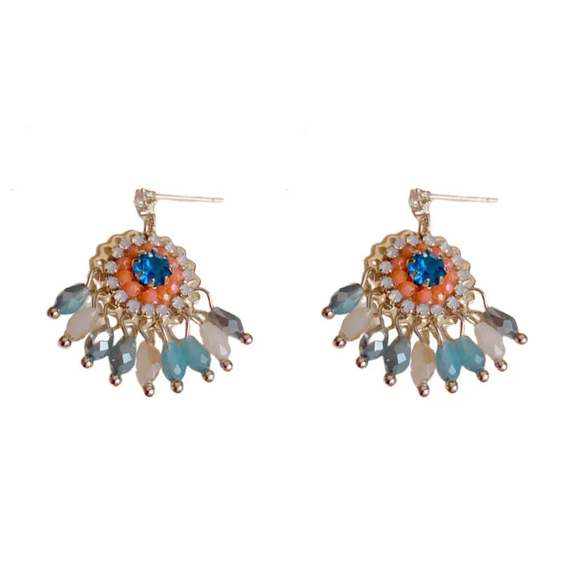 Geometric crystal tassel earrings with thick gold plating and embedded diamond crystals