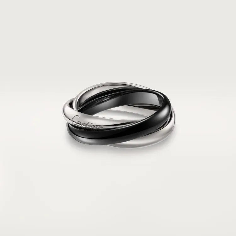 A pair of silver couple rings with a full diamond setting and U-shaped geometric design on a grey background.