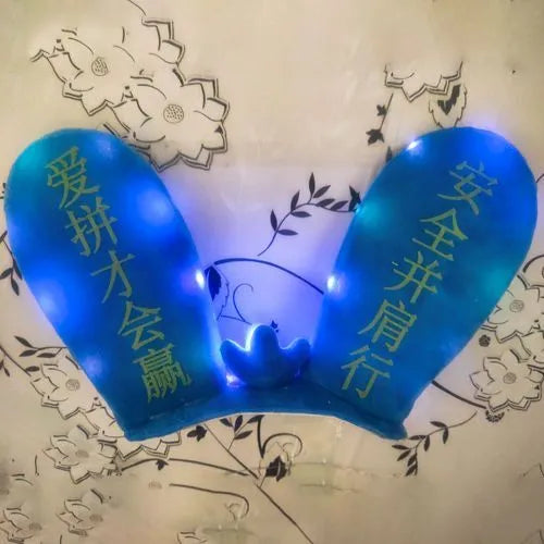 Rabbit Glow helmet decoration with Velcro bottom on a ski helmet, shown in blue LED style.