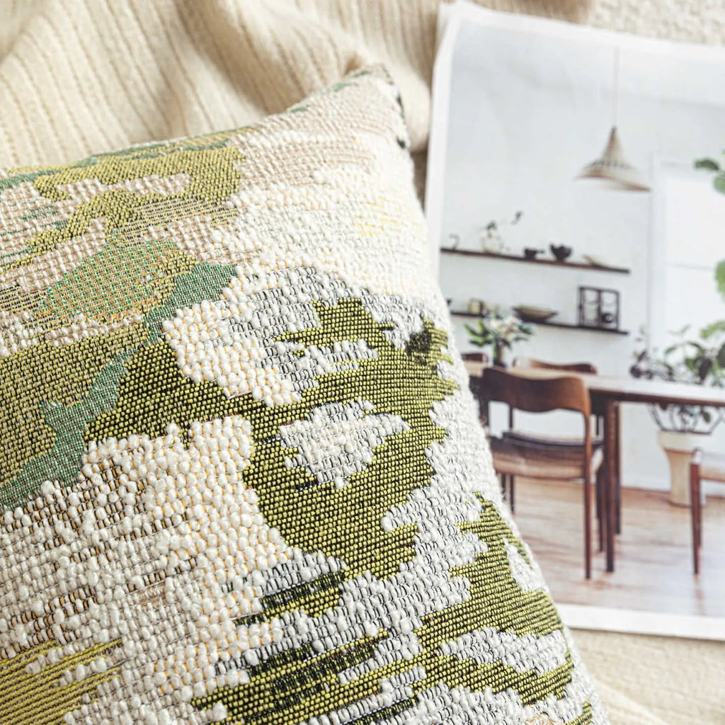 Antique green decorative pillow with abstract botanical pattern, available in square and waist pillow sizes