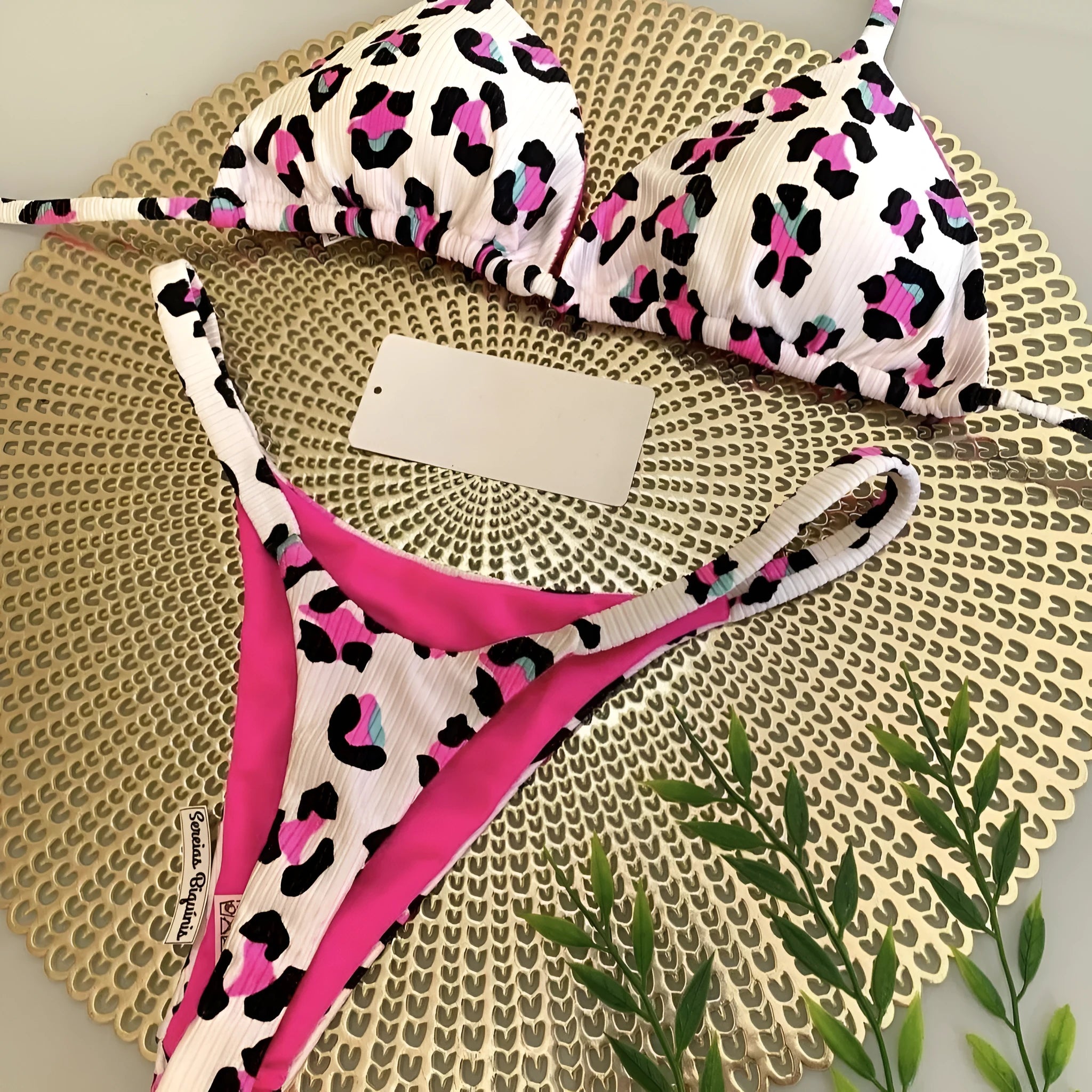 Women's printed nylon bikini with briefs style and cotton lining for swimming sports.