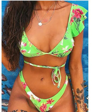 Yellow floral print split bikini swimsuit set for surfing on mannequin