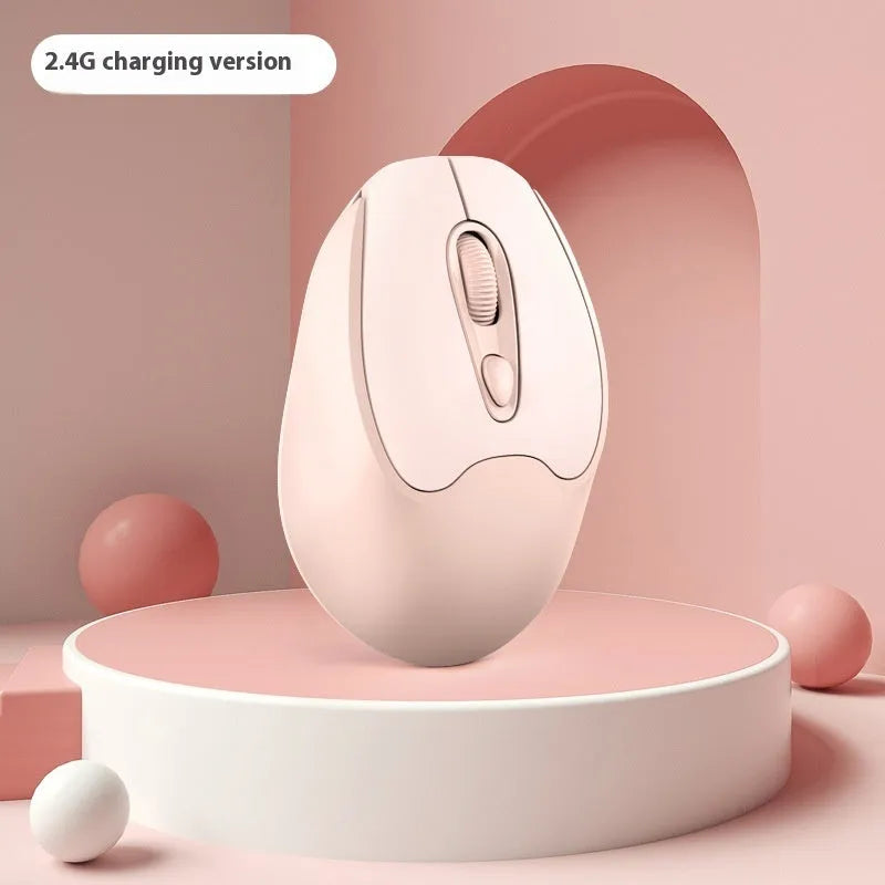 Bluetooth wireless mouse in choice of girl pink, milk tea pink, grey or green colours on a desk next to a laptop.