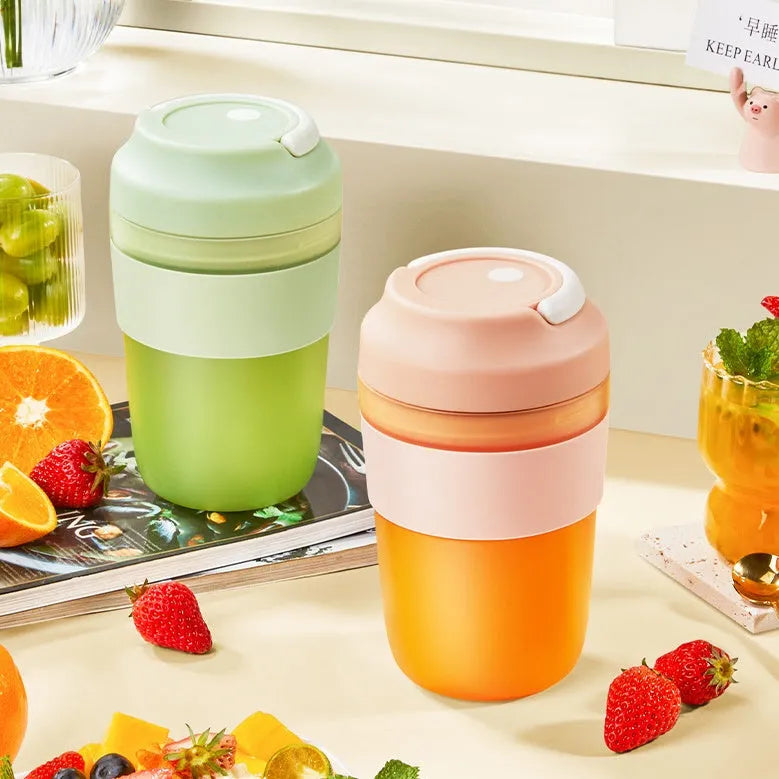 Grape purple portable rechargeable blender juicer cup with 400ml capacity and four stainless steel blades.